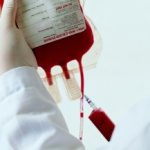 How does a blood transfusion work for acne?