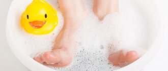 Baby&#39;s feet in a warm bath with sodium bicarbonate